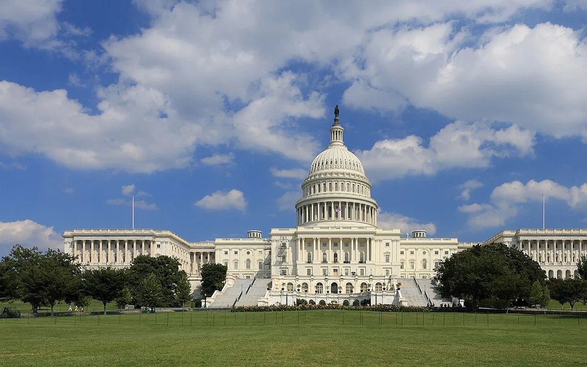 The west front of the US Capitol in Washington under a cloudy sky