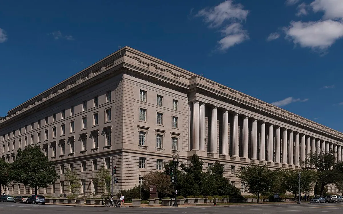 The Internal Revenue Service Building on Constitution Avenue in Washington, its long limestone facade under a blue sky
