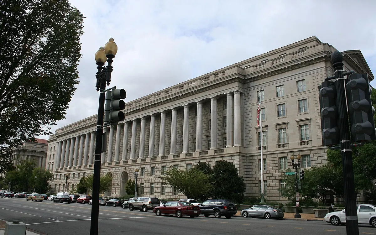 The Internal Revenue Service Building on Constitution Avenue in Washington, seen from the street under a grey sky